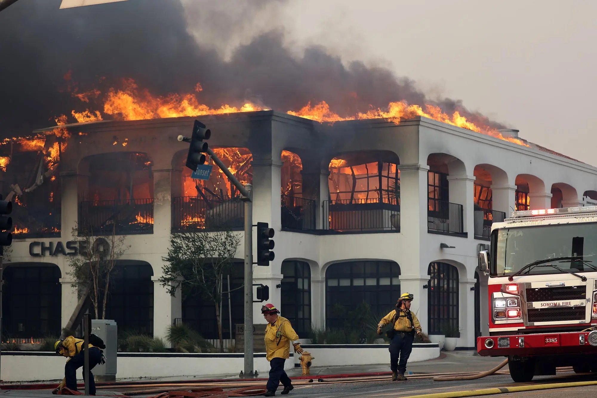 CAL FIRE firefighters fighting a brush fire in Los Angeles County.