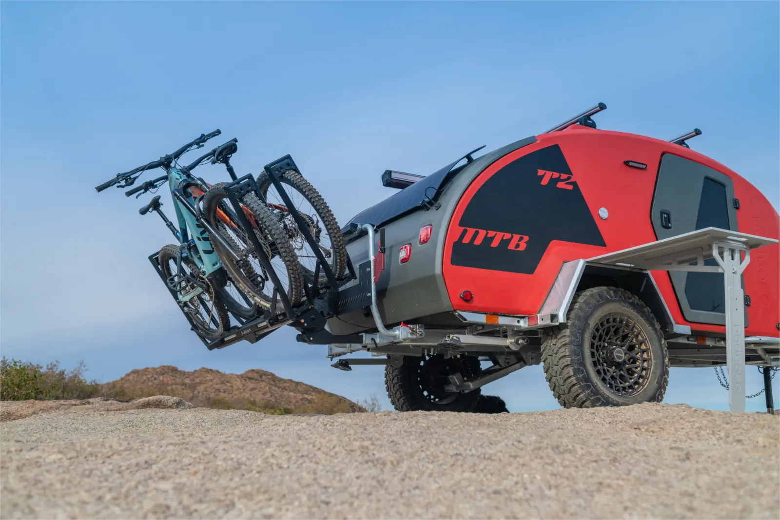 Escapod TOPO2 MTB trailer with its integrated exterior table out and bike rack tilted.