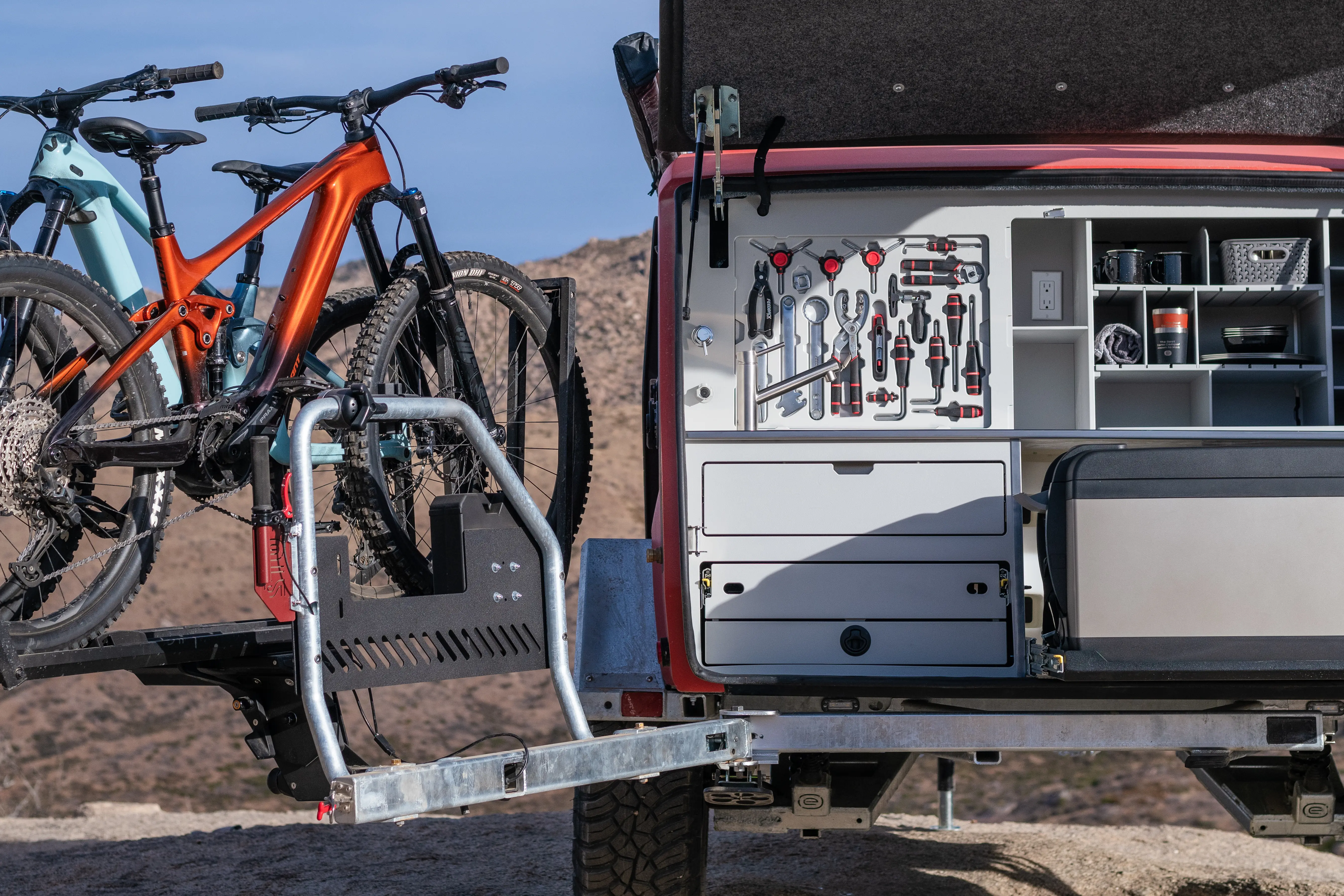 The rear of the Escapod trailer showing the bike repair tool kit and the Switchback Hitch mechanism.