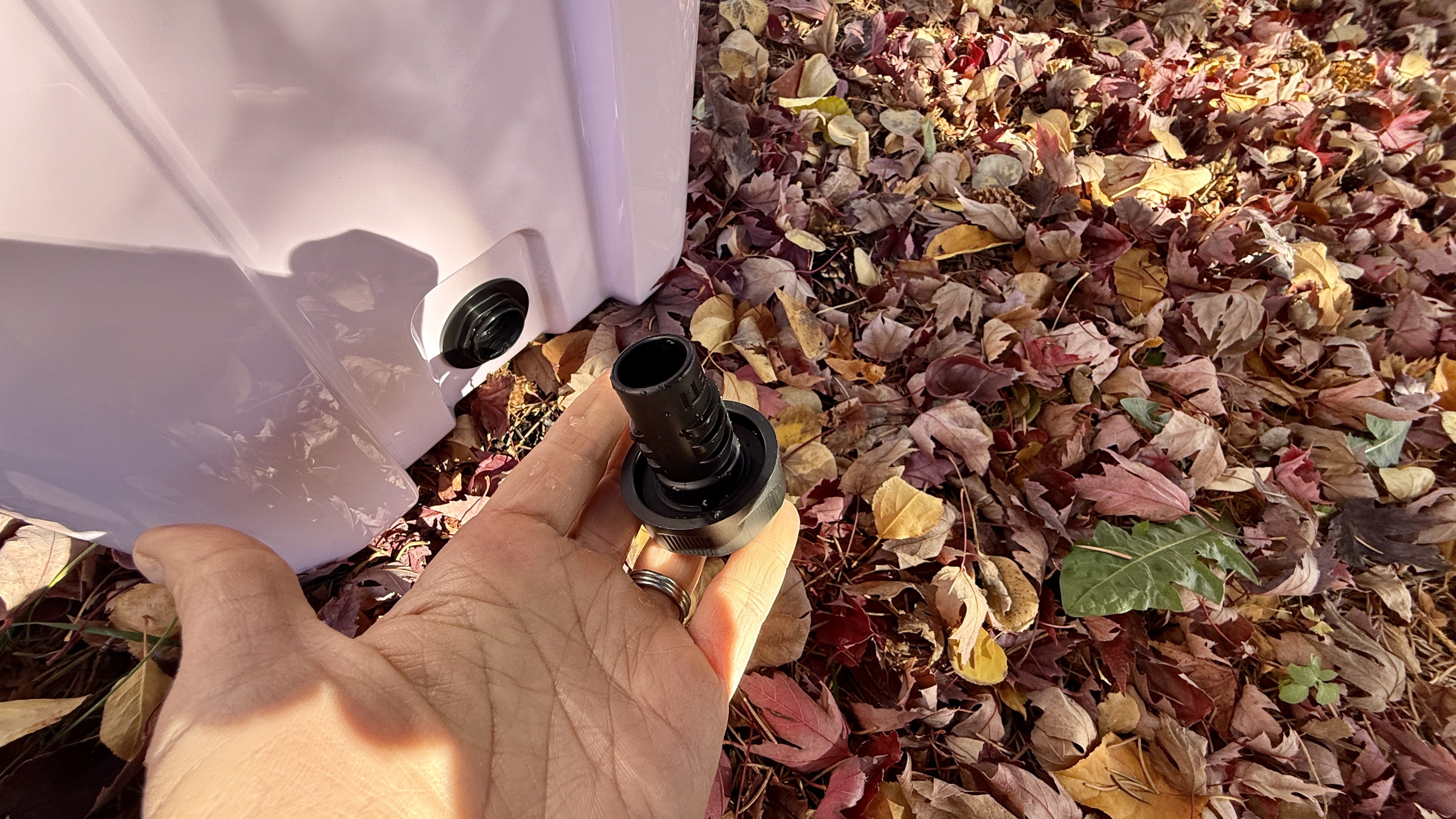 Close-up of the YETI Roadie 24 drain plug area with the cap removed.