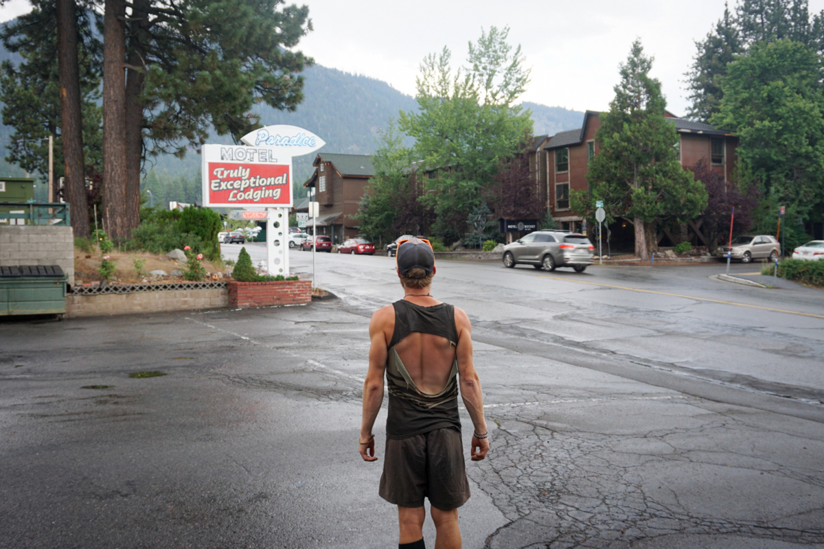 A hiker on the PCT wearing an ill-fitting cotton tank top.