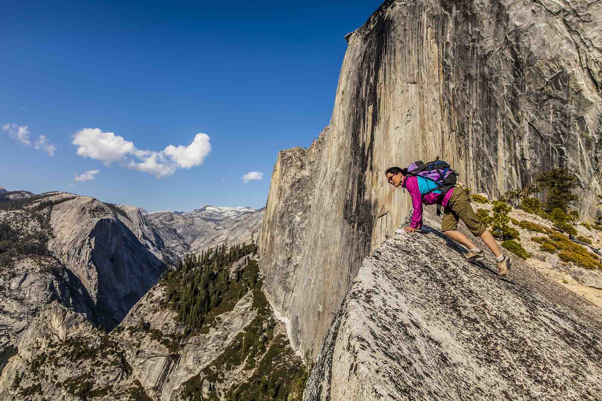 A rock climber ascending a granite face in Yosemite National Park.