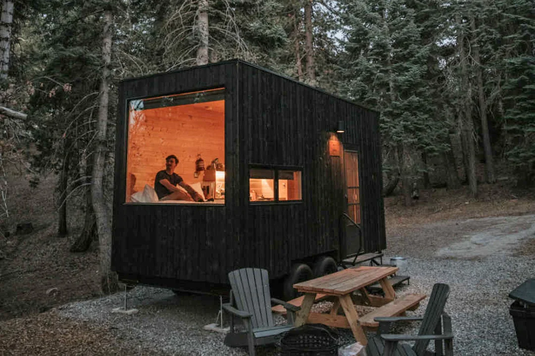 A minimalist tiny house cabin by Getaway in the Skagit Valley woods.