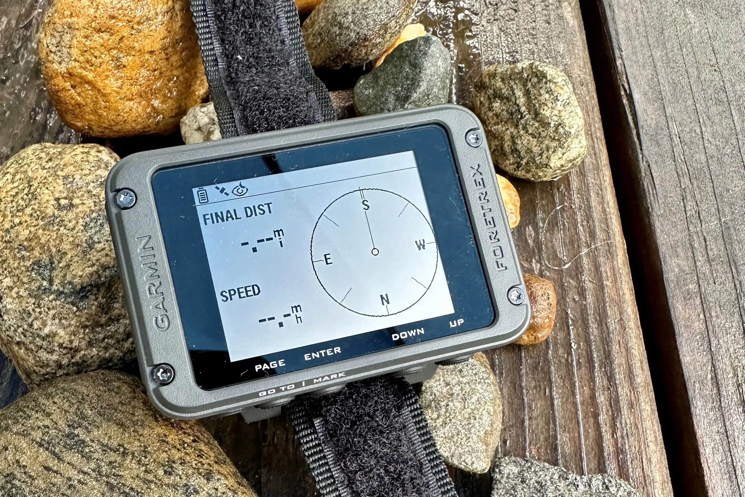 A new Garmin Foretrex 801 with its distinctive monochrome screen and physical side buttons.
