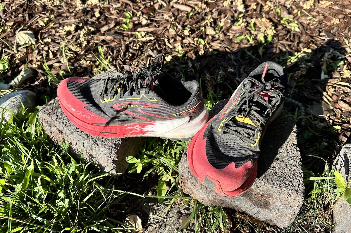 Brooks Catamount trail shoes resting in a grassy outdoor area.