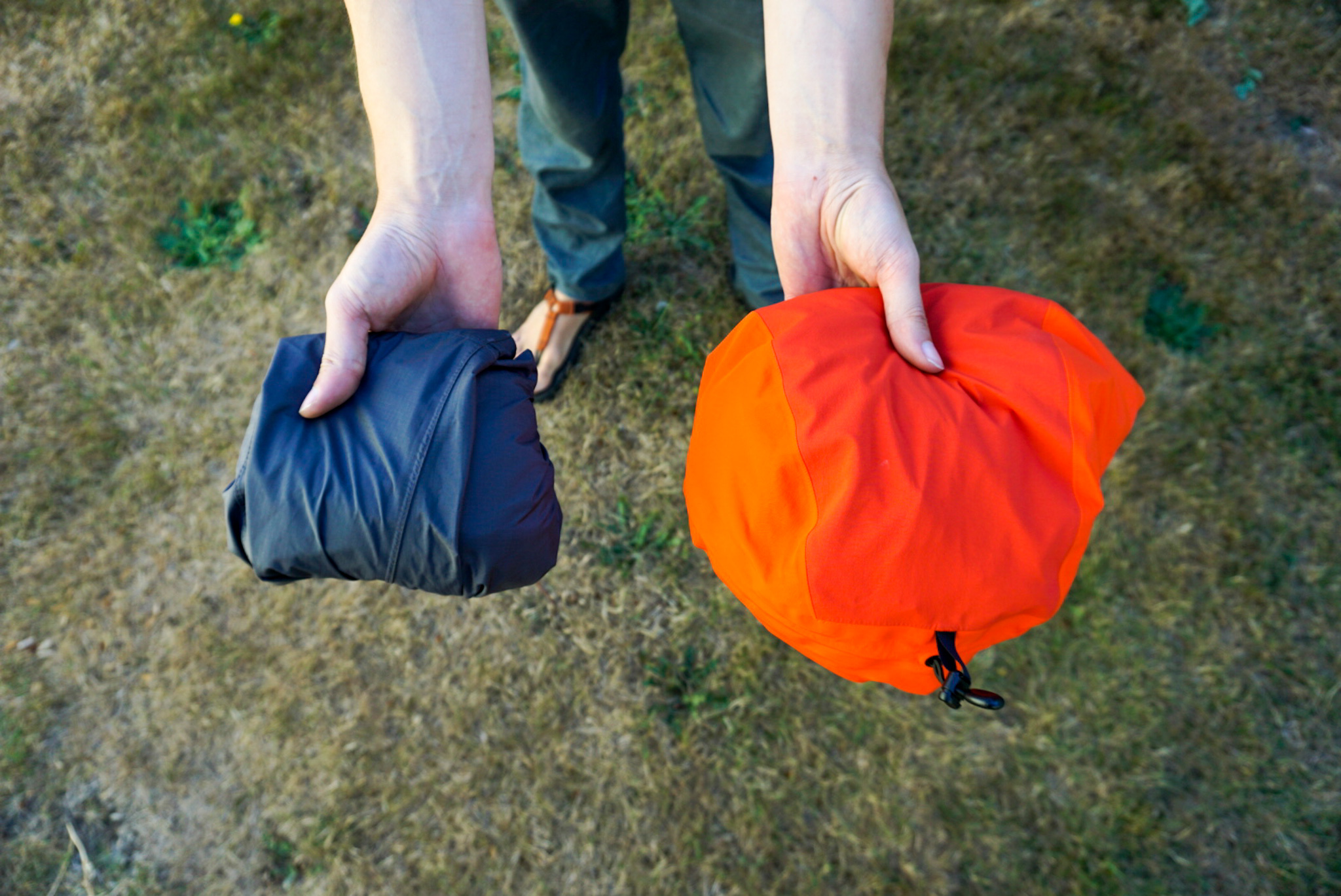 Size comparison of different rain jackets packed down.