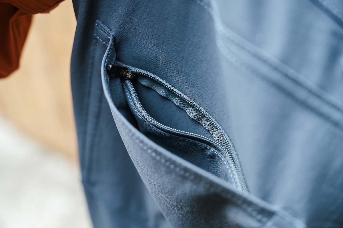 Close-up of a hidden internal zippered pocket on a pair of travel pants.