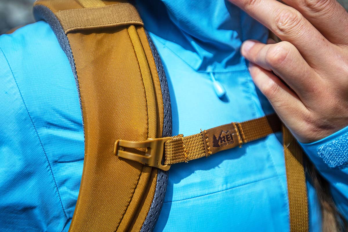 Close-up of the adjustable sternum strap on a women's hiking pack.