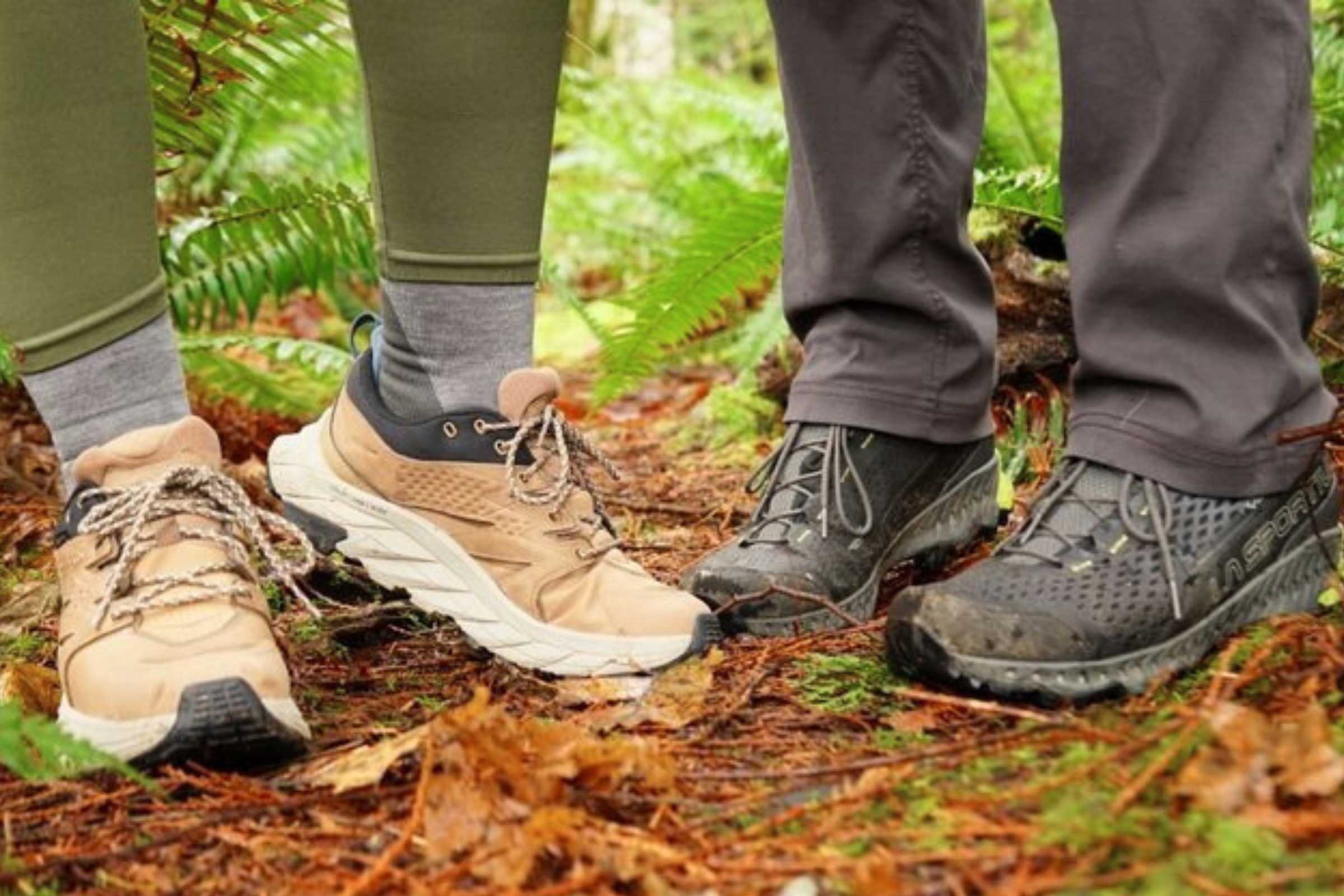A comparison shot of the HOKA Anacapa and La Sportiva Spire hiking shoes on a dirt path.