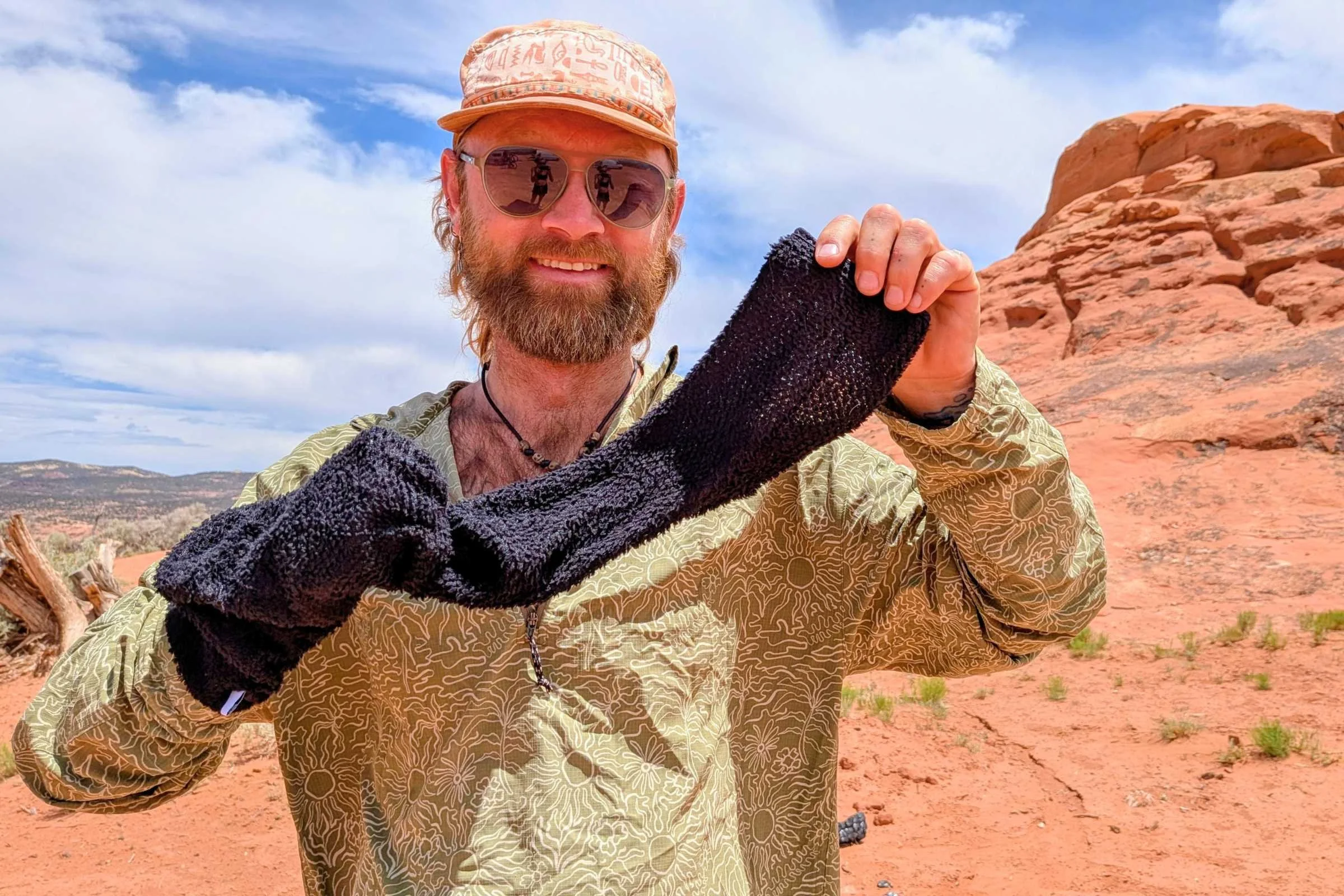 Five-gallon buckets marked with hiker names stashed at a designated desert cache location.
