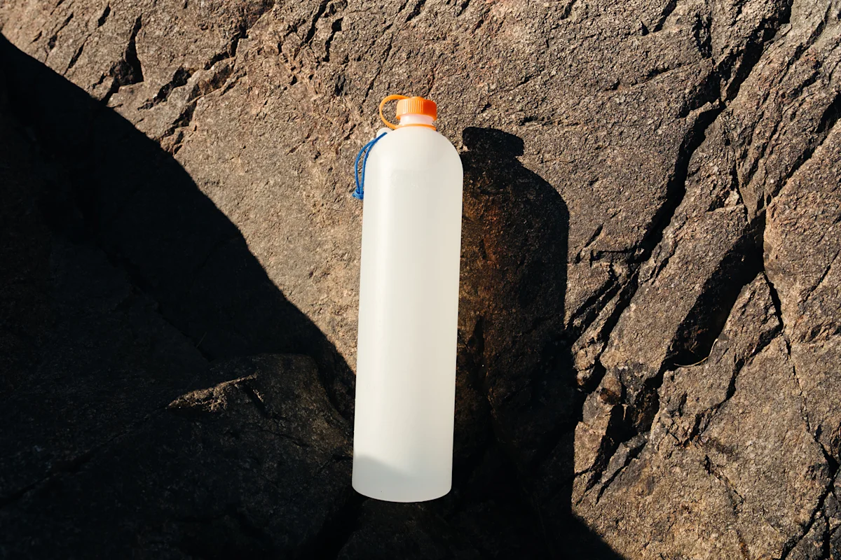 The CNOC ThruBottle highlighting its translucent HDPE material and slim profile.