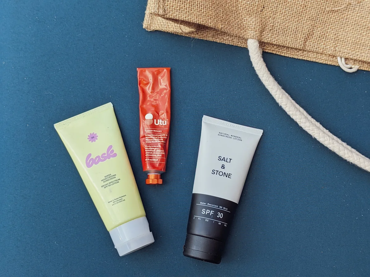 A variety of mineral sunscreen products from various brands arranged together.