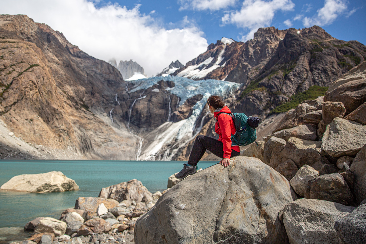 A woman hiking in Patagonia with an Osprey Tempest 22 daypack.