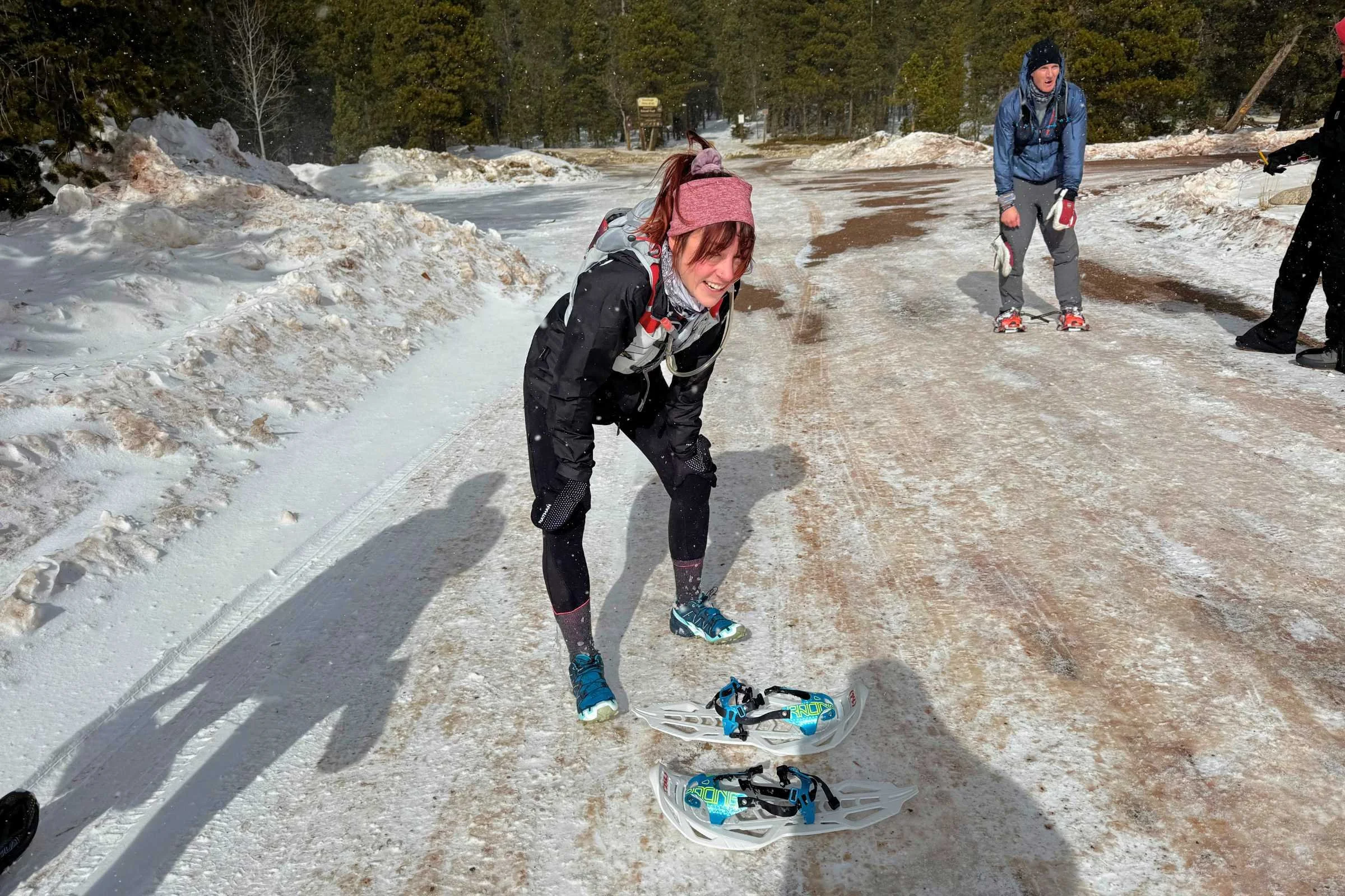 A racer looking relieved and tired immediately after finishing a winter race.
