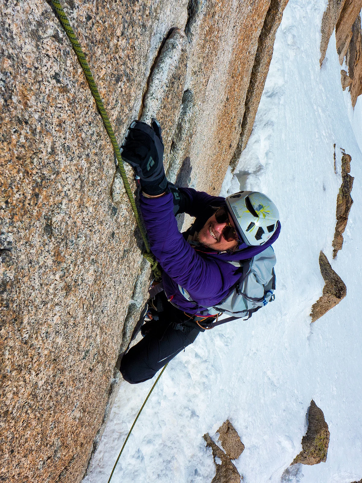 Climber Marko Prezelj geared up in Patagonia technical outerwear on a mountain face.