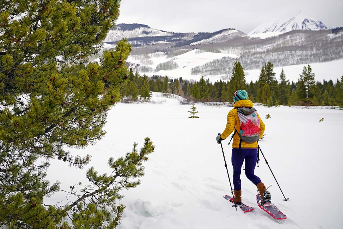 A hiker using MSR Lightning Ascent snowshoes in deep snow in the Colorado mountains.