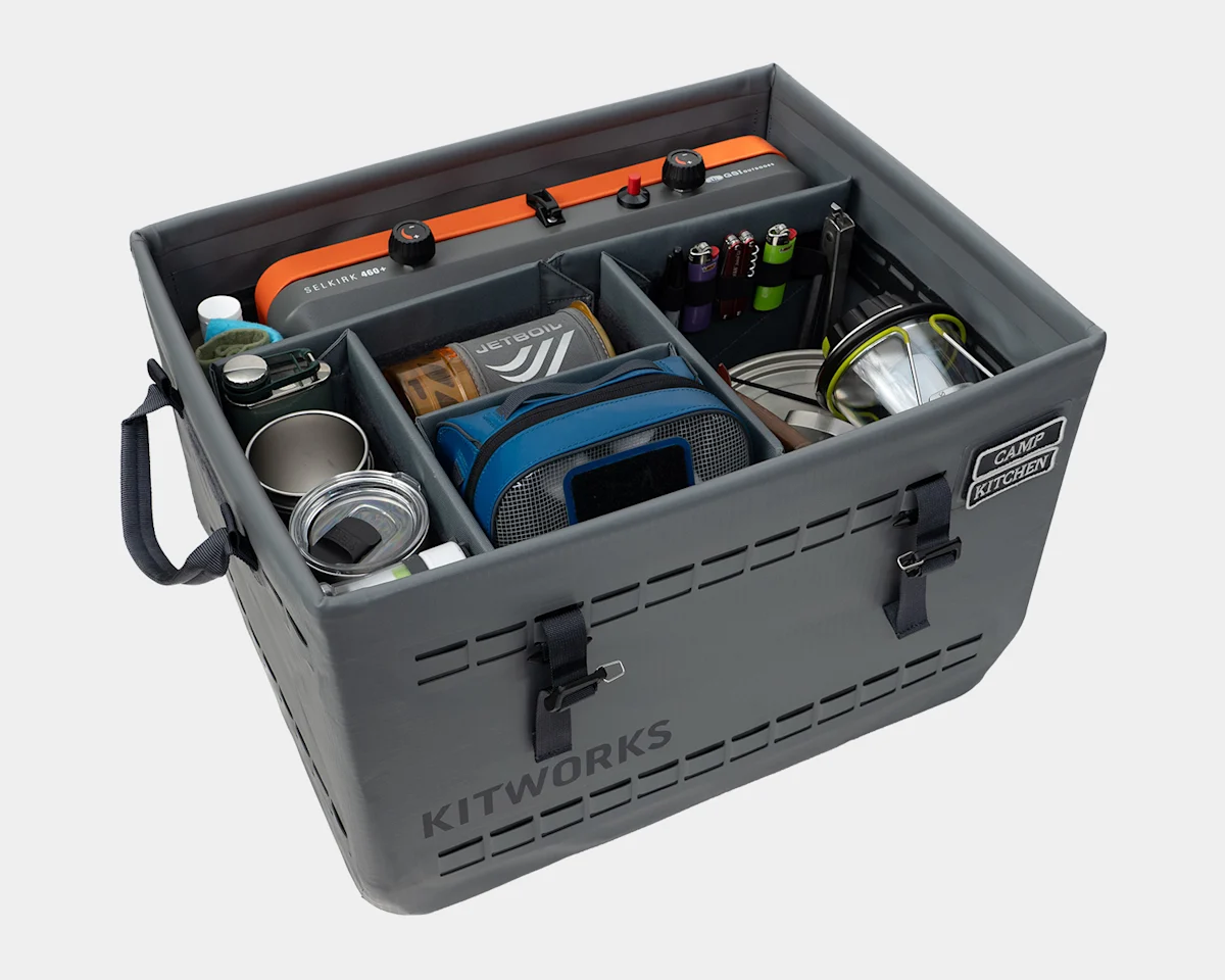 A modular gear bin organized specifically as a camping kitchen kit with stoves and utensils.