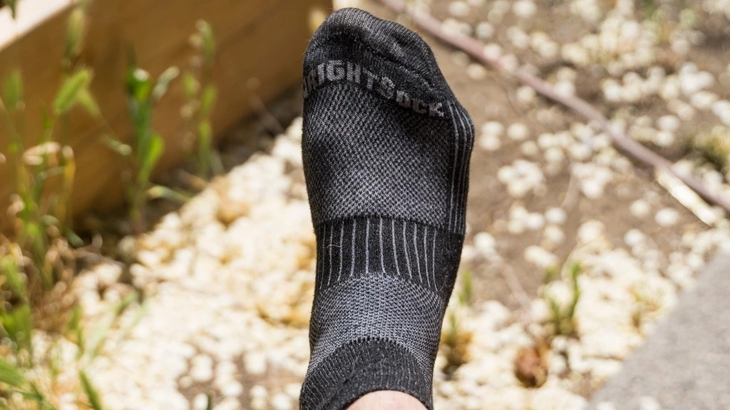 Close-up of a synthetic athletic sock showing breathable mesh construction zones.