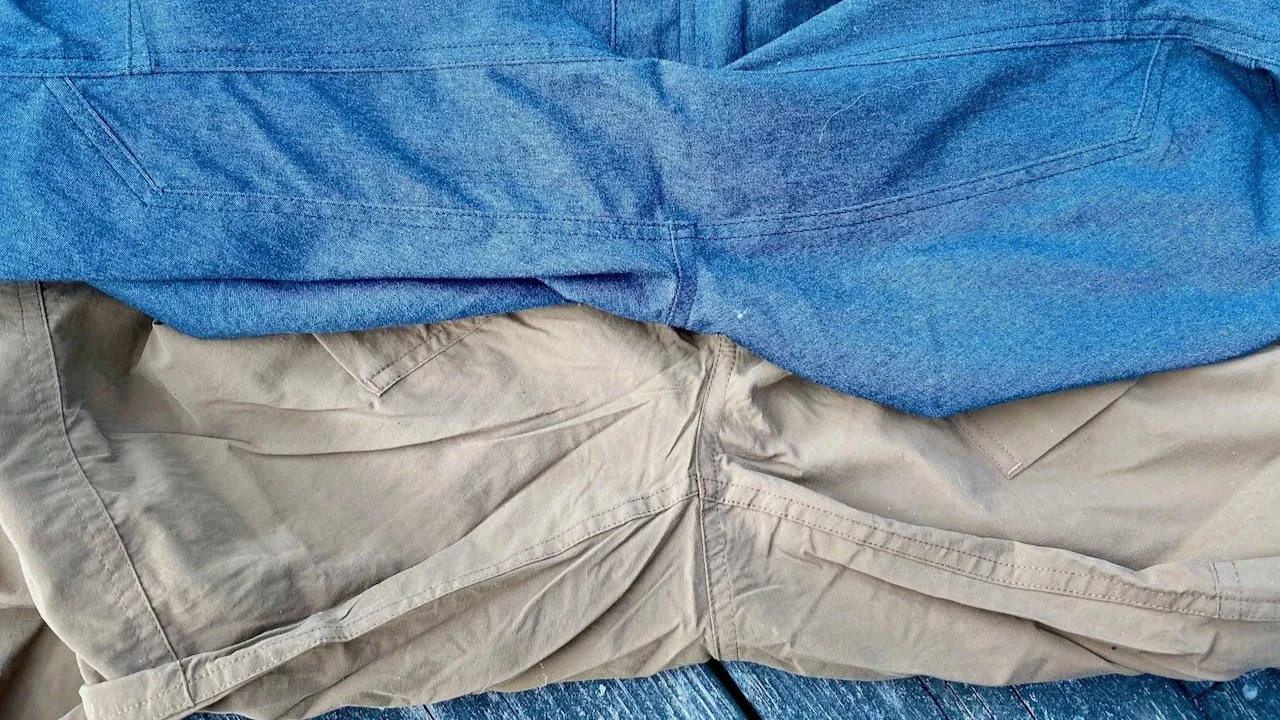 Two pairs of hiking pants shown side-by-side to compare a gusseted crotch versus a standard seam.