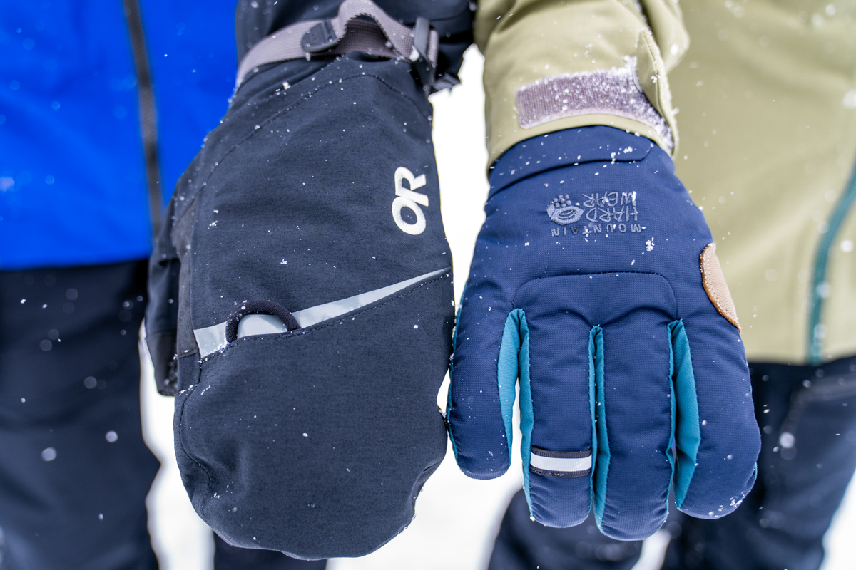 A direct comparison of a snowboard glove versus a snowboard mitten.