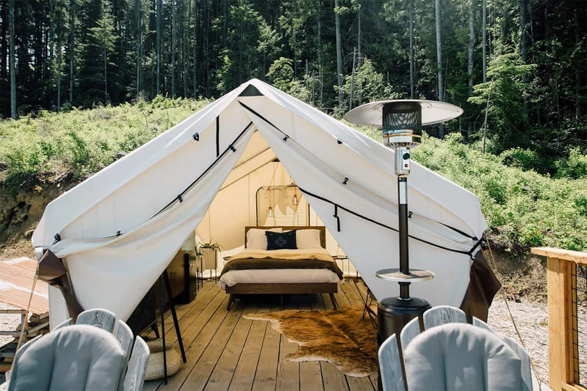 A modern geodesic glamping dome located in a forest clearing near Port Angeles.