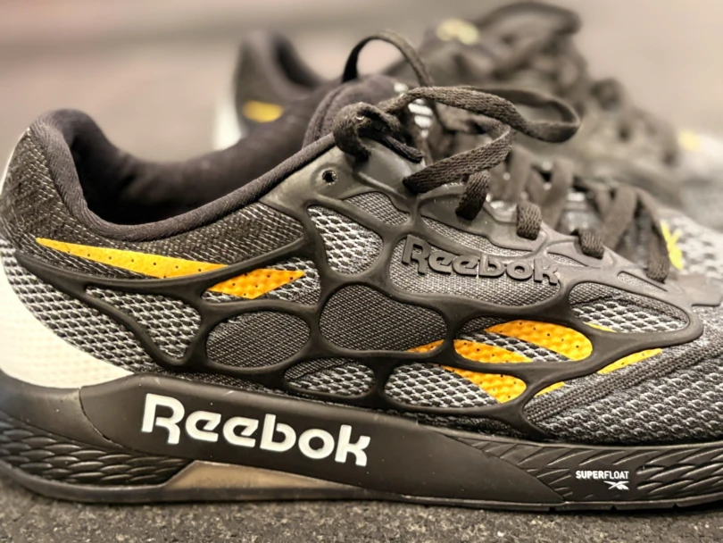 Macro view of the protective TPU cage on the side of the Reebok Nano Pro shoe.