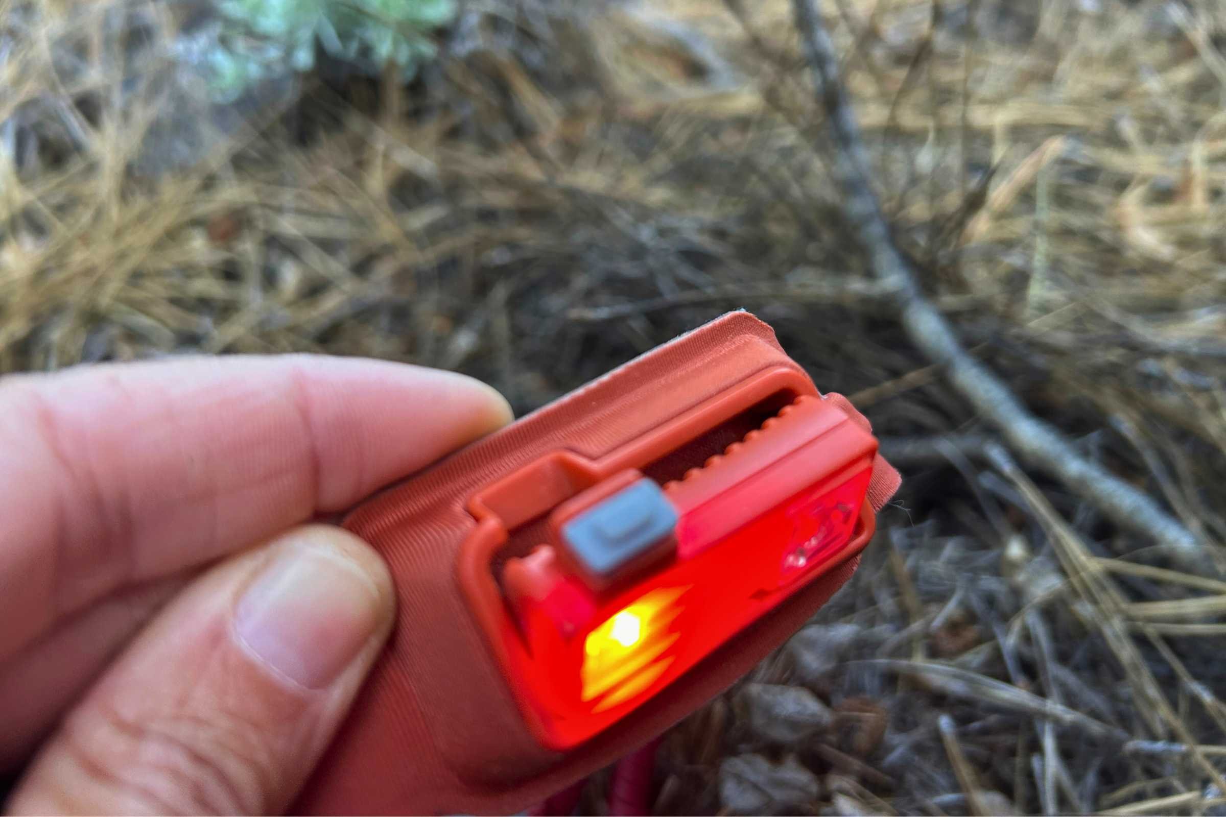A hand demonstrating the tilting mechanism of the BioLite Dash 450 front casing.